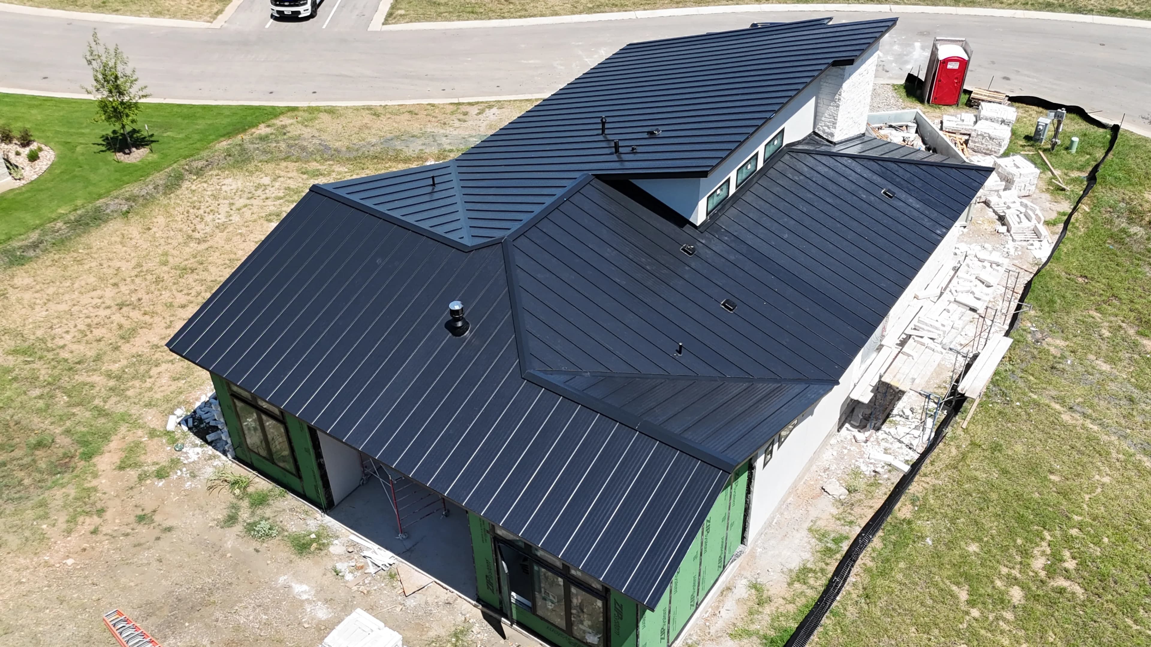 Project Matte Black Standing Seam Metal Roofing at Tuscan Village image