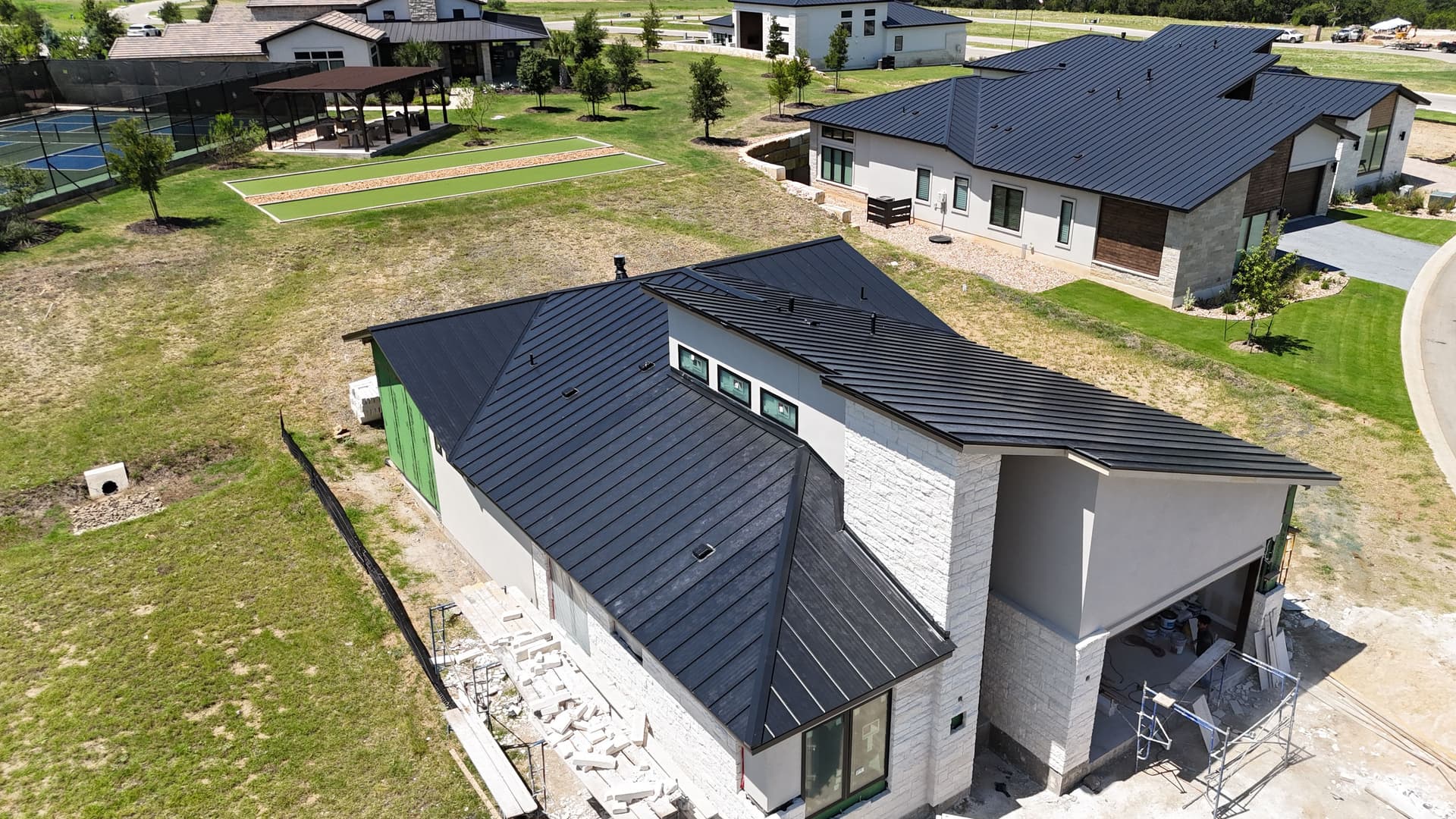 Gallery photos for Matte Black Standing Seam Metal Roofing at Tuscan Village: Image #1