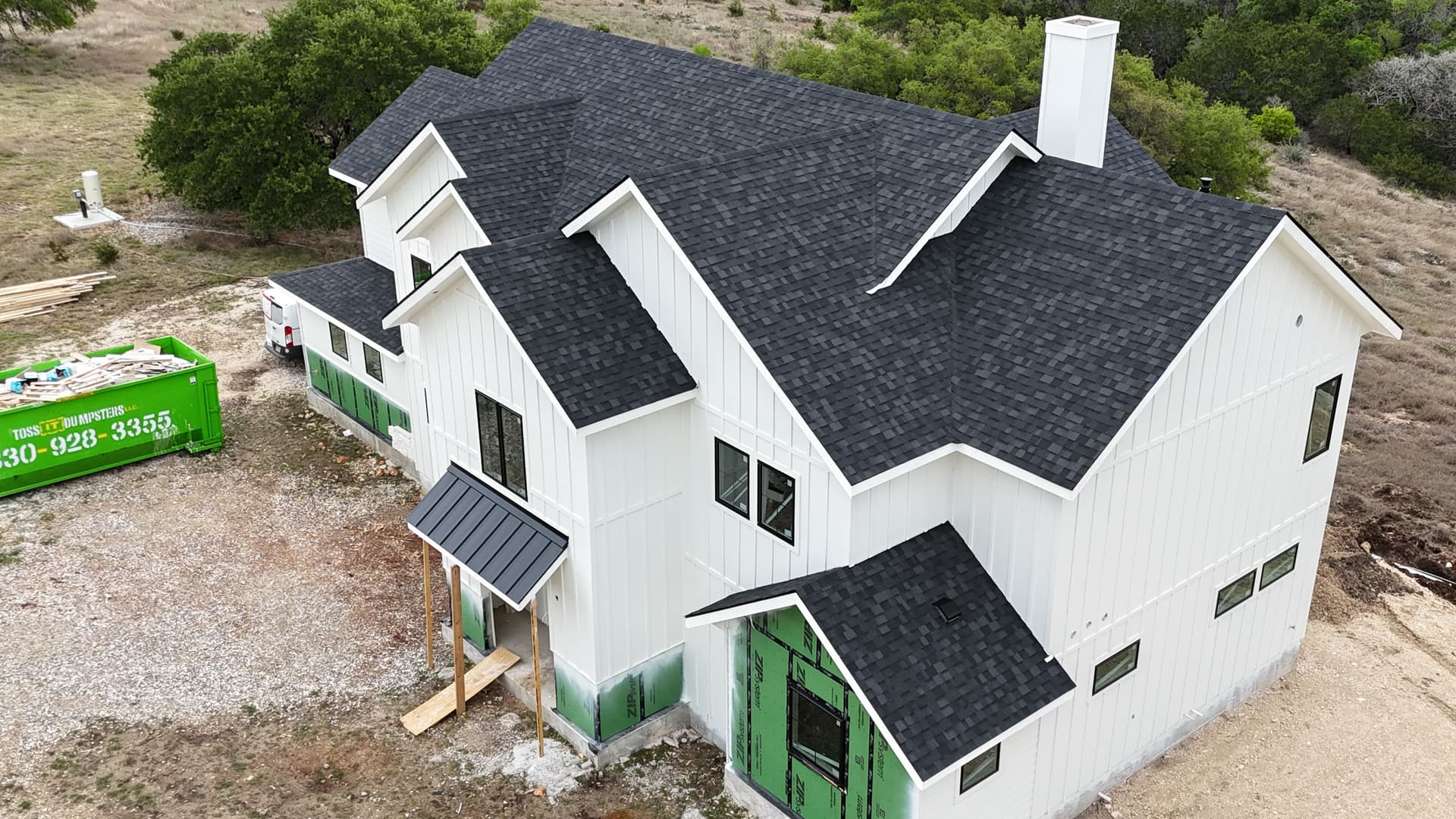 Lifetime Shingle Roof with Metal Accents on a Modern Country Home image